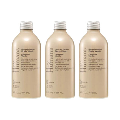 Turn Every Shower Into a Calming with Hey Humans Lavender Body Wash bottles stacked together.